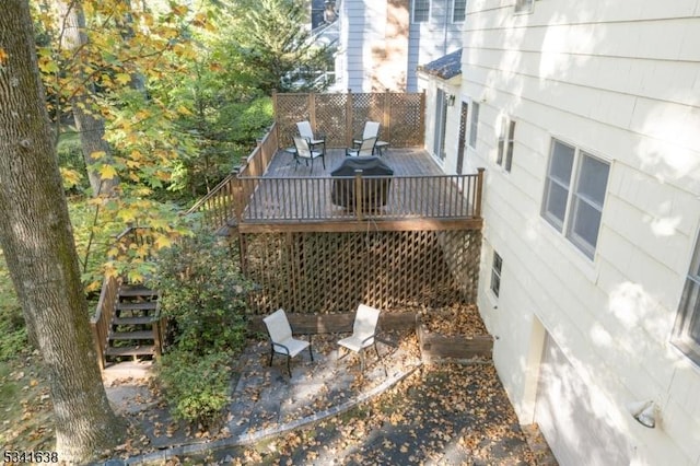 exterior space with a deck and stairs