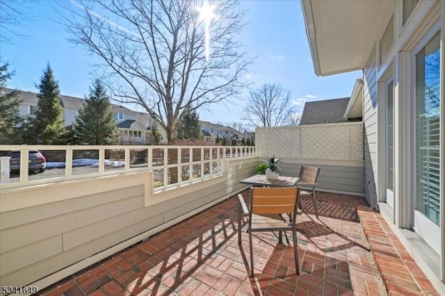 balcony with a sunroom and a patio