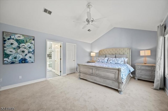 carpeted bedroom with ceiling fan, ensuite bathroom, visible vents, baseboards, and vaulted ceiling