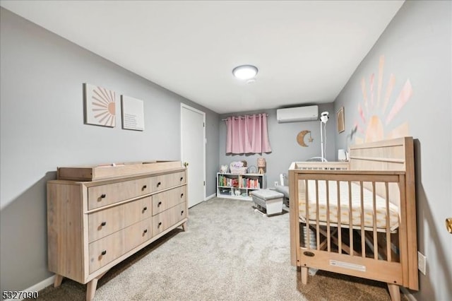 carpeted bedroom with baseboards and a wall mounted air conditioner