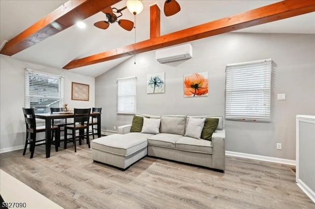 living area with vaulted ceiling with beams, a wall mounted AC, wood finished floors, and baseboards