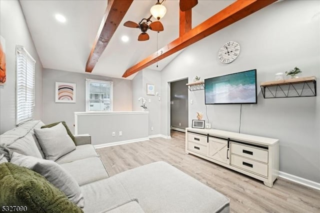 living area with vaulted ceiling with beams, light wood-style flooring, baseboards, and a ceiling fan