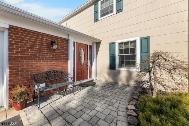 entrance to property with brick siding