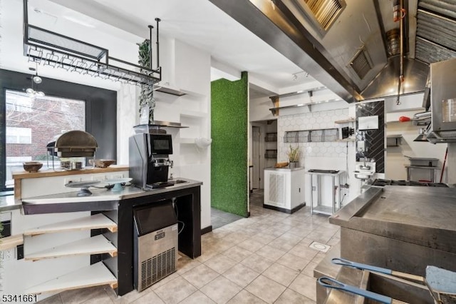 kitchen with tile patterned flooring, open shelves, and beamed ceiling