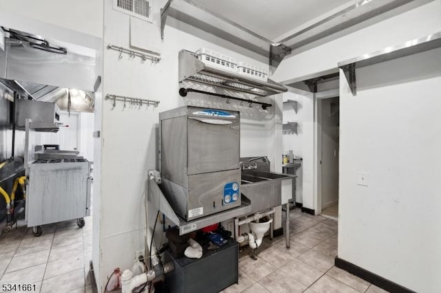 kitchen featuring light tile patterned floors and visible vents