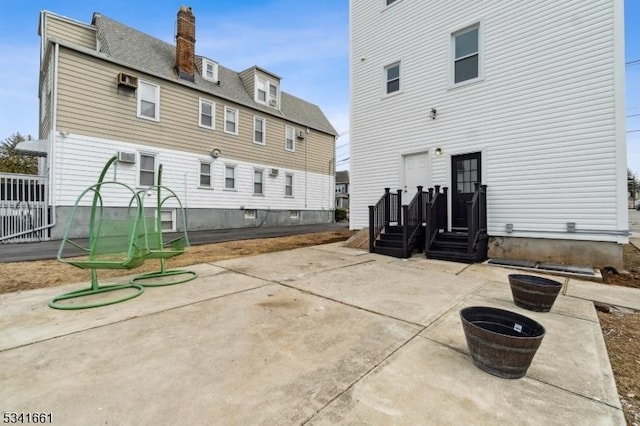 back of property featuring a patio