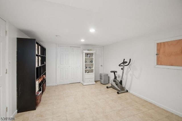 workout area featuring baseboards and recessed lighting