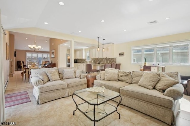 living area featuring visible vents, lofted ceiling, an inviting chandelier, baseboard heating, and recessed lighting