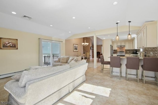 living area featuring vaulted ceiling, recessed lighting, visible vents, and a notable chandelier