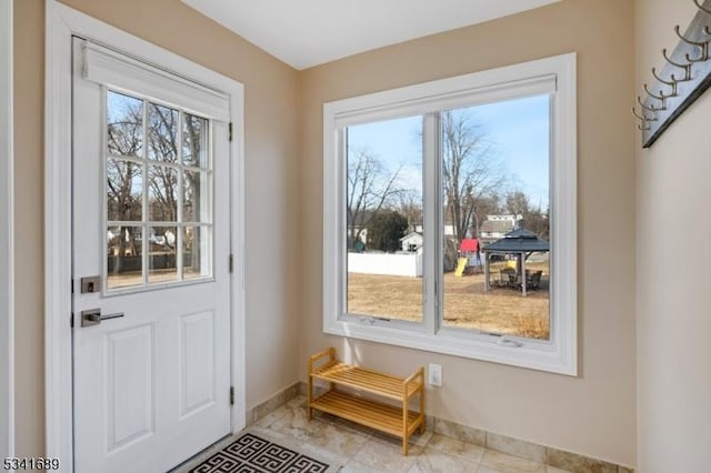 entryway featuring baseboards