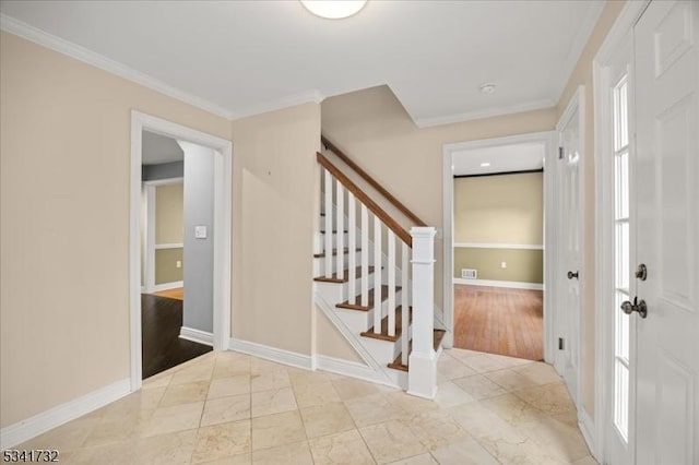 entryway with marble finish floor, visible vents, ornamental molding, baseboards, and stairs