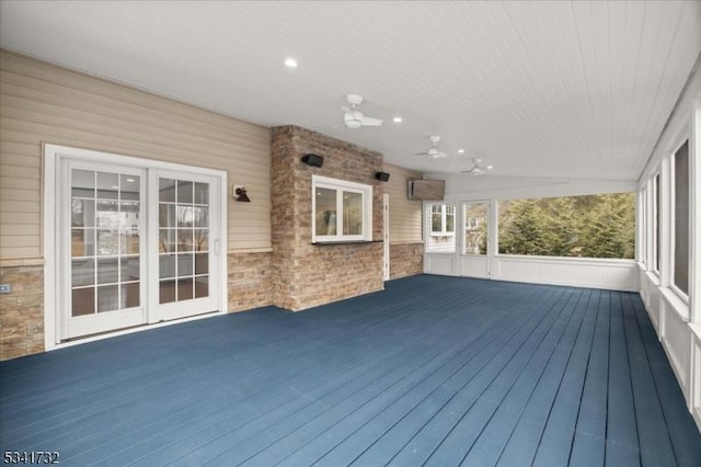 wooden deck featuring ceiling fan