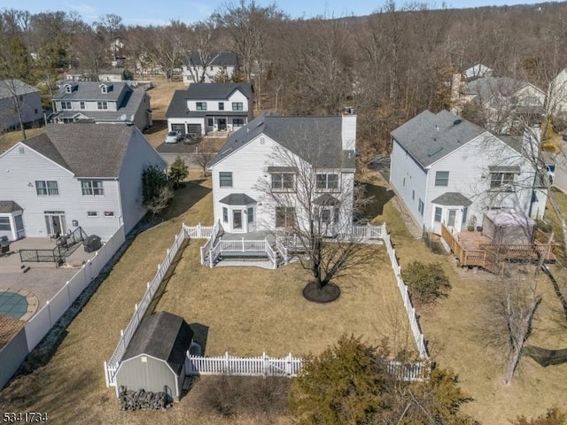 birds eye view of property with a residential view