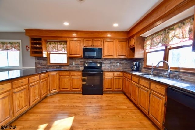 kitchen with black appliances, open shelves, a sink, and brown cabinets