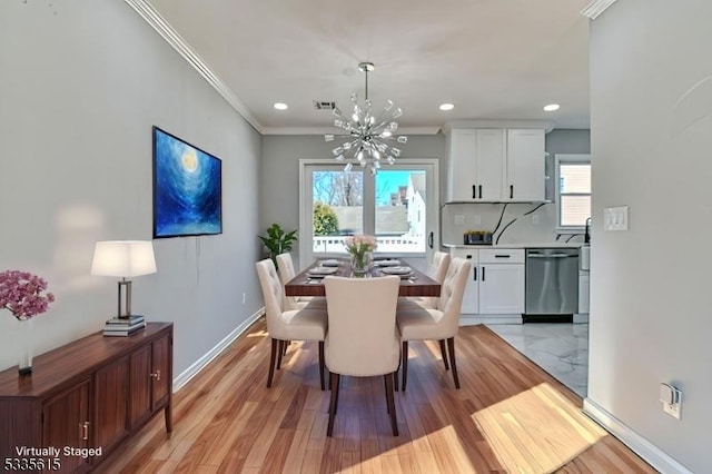 dining room with baseboards, visible vents, ornamental molding, an inviting chandelier, and recessed lighting