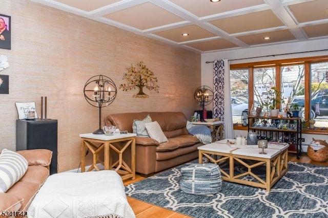 living area featuring recessed lighting, coffered ceiling, and wood finished floors