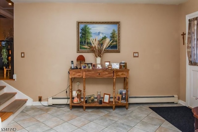 interior space with light tile patterned floors, a baseboard radiator, stairs, and baseboards