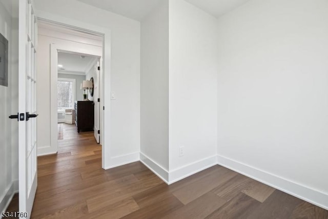 interior space featuring dark wood-style floors and baseboards