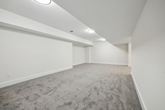 finished basement with carpet flooring and baseboards