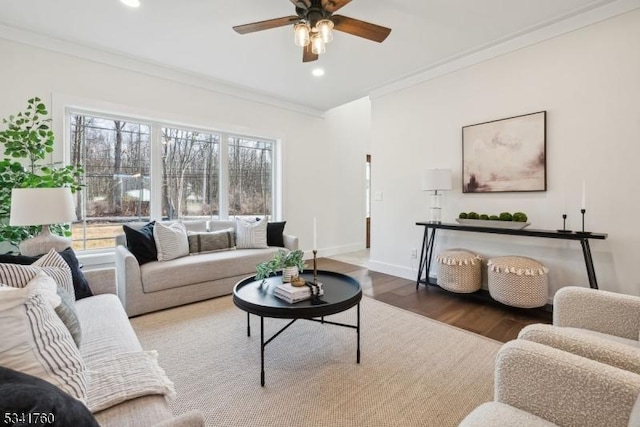 living room featuring recessed lighting, ornamental molding, a ceiling fan, wood finished floors, and baseboards