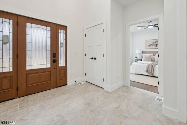 entryway with visible vents and baseboards