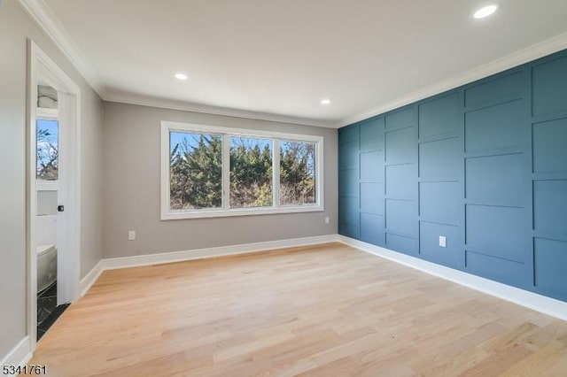 unfurnished room featuring ornamental molding, recessed lighting, and light wood-style flooring