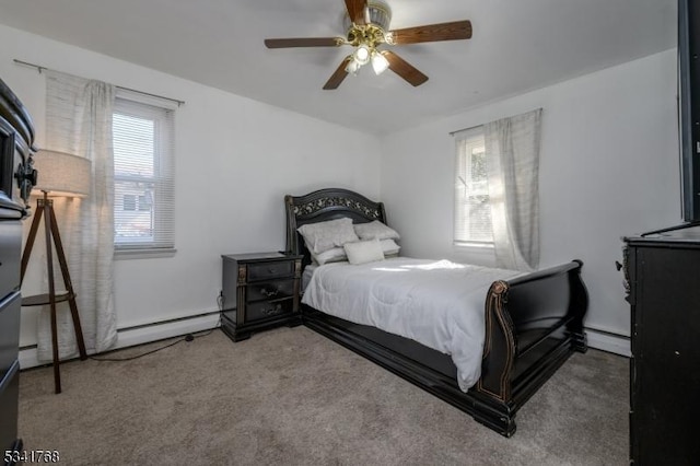 bedroom featuring carpet, a baseboard radiator, a baseboard heating unit, and a ceiling fan