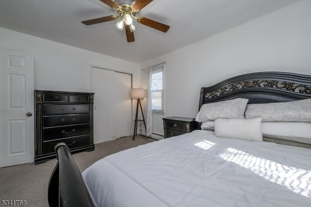 carpeted bedroom with a ceiling fan