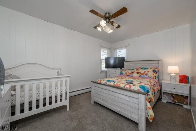 bedroom featuring a baseboard heating unit, ceiling fan, and carpet