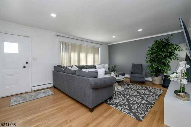 living area featuring a baseboard radiator, recessed lighting, wood finished floors, ornamental molding, and baseboard heating