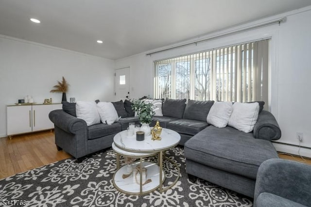 living room with crown molding, baseboard heating, wood finished floors, and recessed lighting