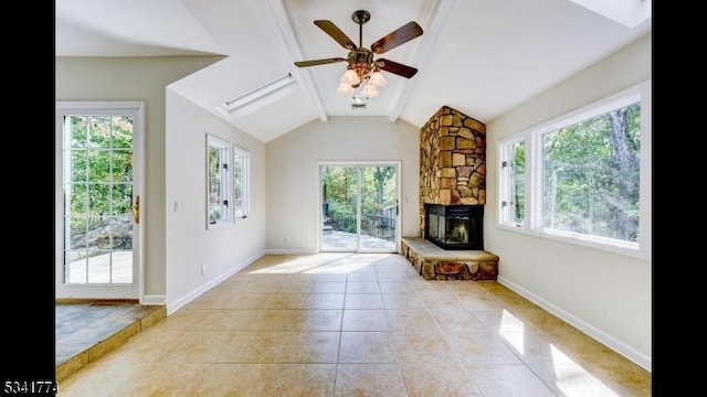 unfurnished living room featuring light tile patterned floors, a fireplace, lofted ceiling with beams, and baseboards