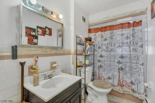 bathroom featuring visible vents, curtained shower, toilet, vanity, and tile walls