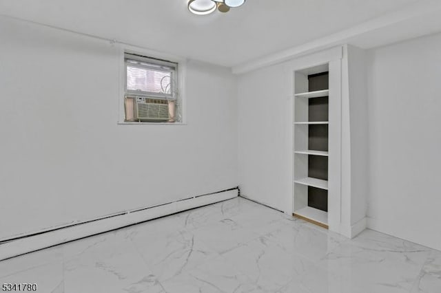 unfurnished room featuring marble finish floor, cooling unit, and a baseboard radiator