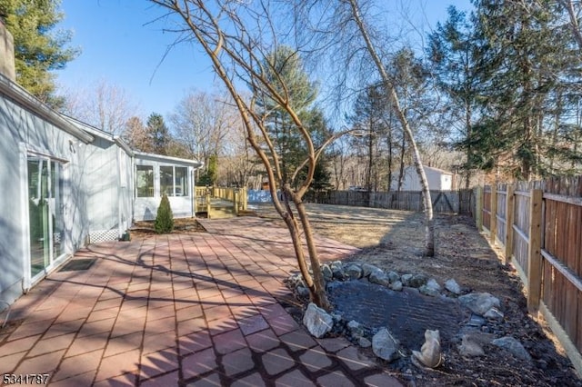 exterior space featuring a patio area and a fenced backyard