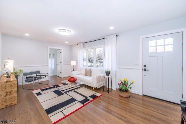 living room with wood finished floors and recessed lighting