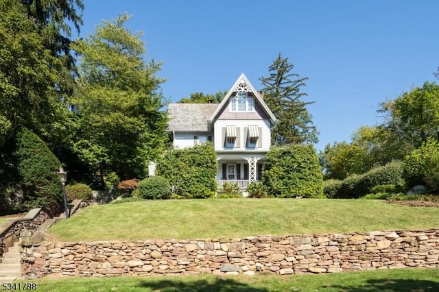 victorian house with a front lawn