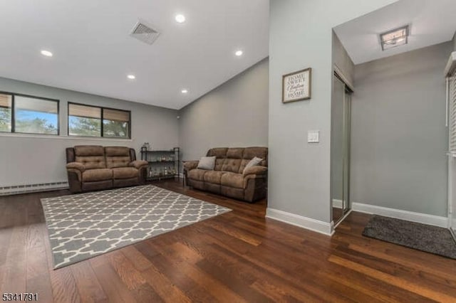 living area featuring visible vents, wood finished floors, recessed lighting, a baseboard radiator, and baseboards