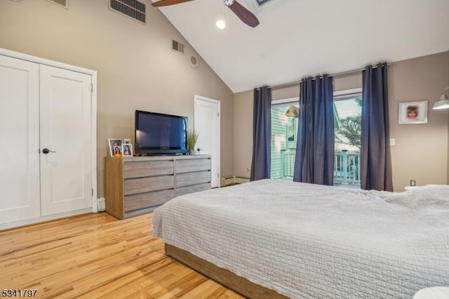 bedroom featuring access to exterior, ceiling fan, visible vents, and wood finished floors