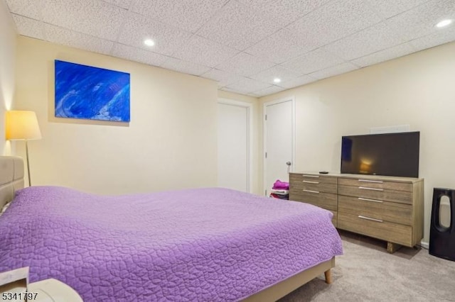 carpeted bedroom with recessed lighting