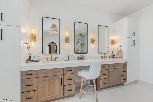 full bathroom with double vanity and a sink