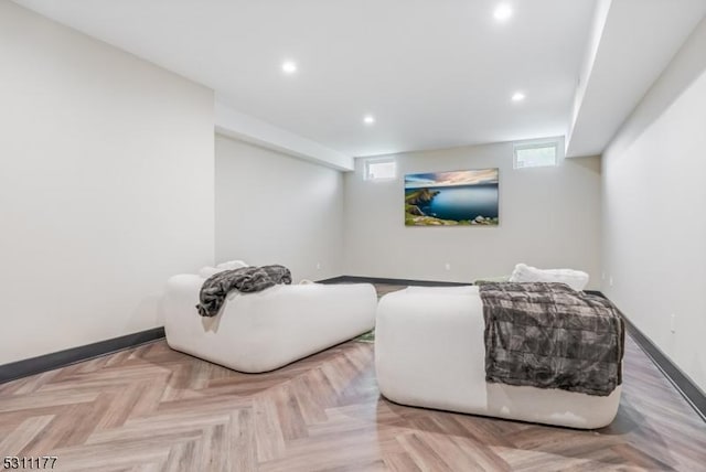 living area with recessed lighting and baseboards