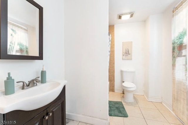 bathroom with tile patterned flooring, toilet, vanity, visible vents, and baseboards