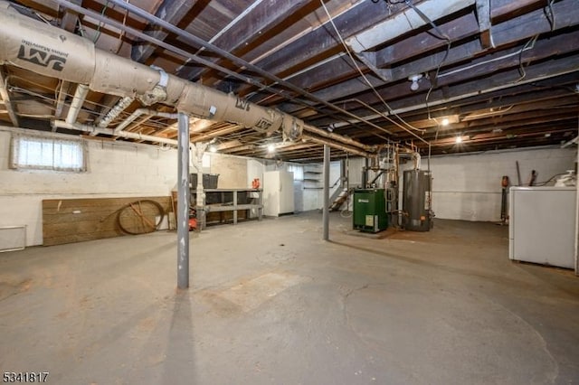 below grade area featuring a heating unit, water heater, and washer / clothes dryer