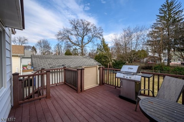 wooden deck with area for grilling