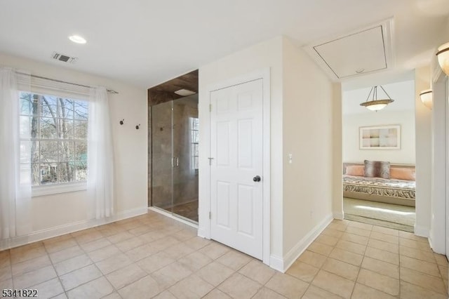 full bathroom with a shower stall, visible vents, baseboards, and tile patterned floors