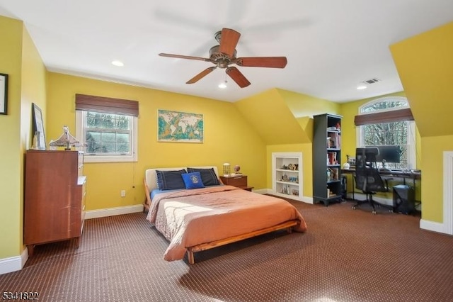 bedroom with carpet flooring, multiple windows, visible vents, and baseboards