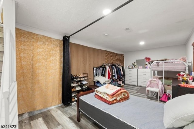 bedroom featuring wood finished floors