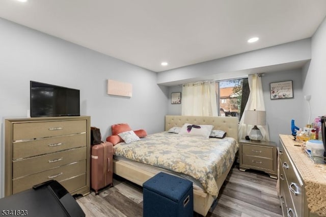 bedroom featuring recessed lighting and wood finished floors