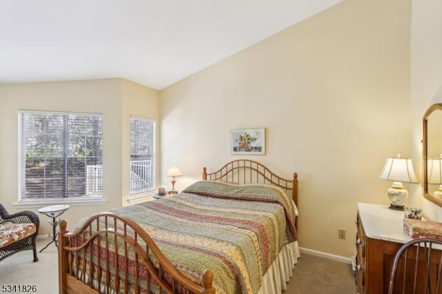 bedroom featuring baseboards and light colored carpet